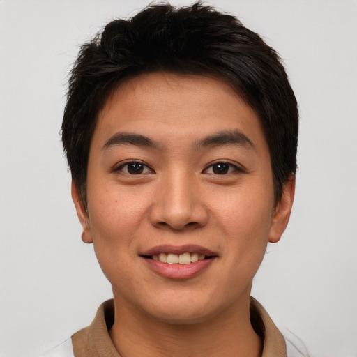 Joyful asian young-adult male with short  brown hair and brown eyes