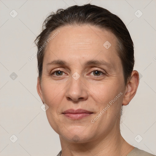 Joyful white adult female with short  brown hair and brown eyes