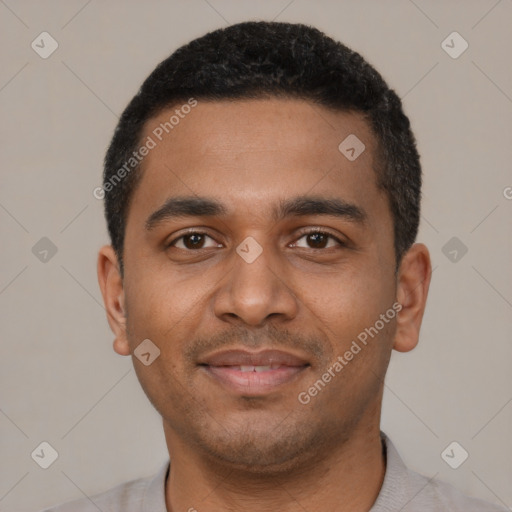 Joyful black young-adult male with short  black hair and brown eyes