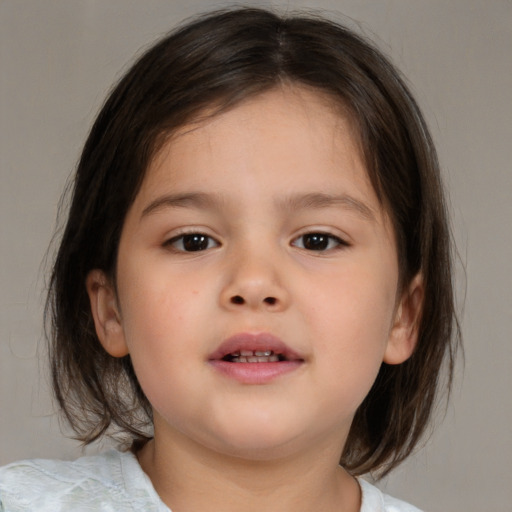 Joyful white child female with medium  brown hair and brown eyes