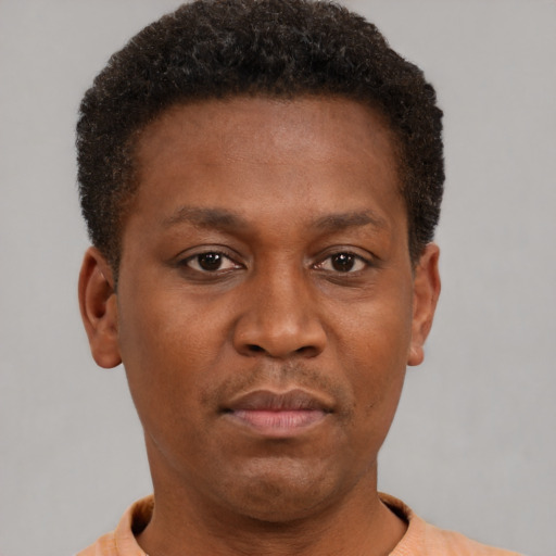 Neutral black young-adult male with short  brown hair and brown eyes