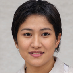 Joyful white young-adult female with medium  brown hair and brown eyes