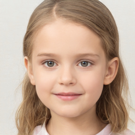 Joyful white child female with medium  brown hair and brown eyes