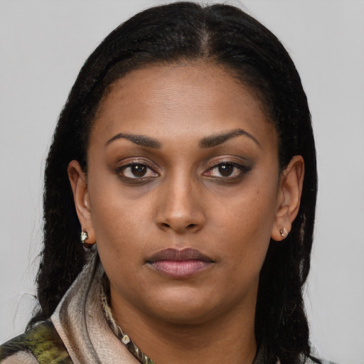 Neutral black young-adult female with long  brown hair and brown eyes