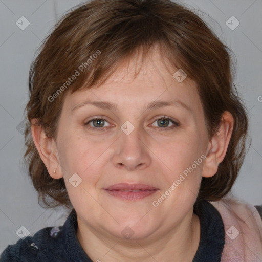 Joyful white adult female with medium  brown hair and blue eyes