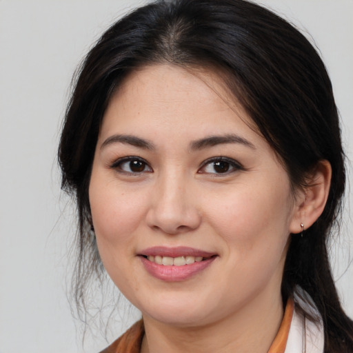 Joyful asian young-adult female with medium  brown hair and brown eyes