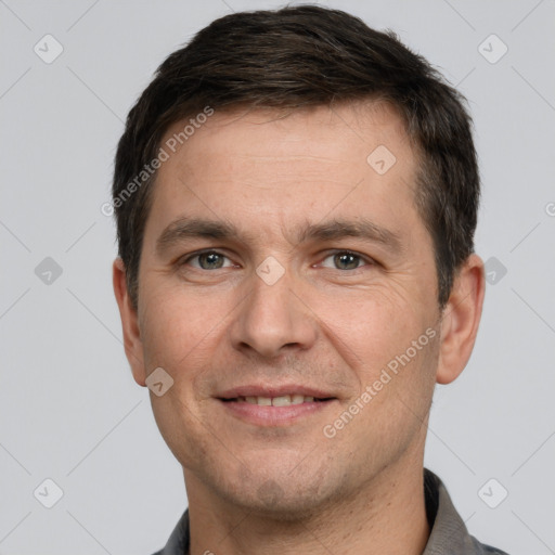 Joyful white adult male with short  brown hair and brown eyes