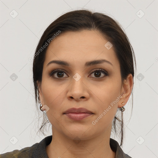 Joyful latino young-adult female with medium  brown hair and brown eyes