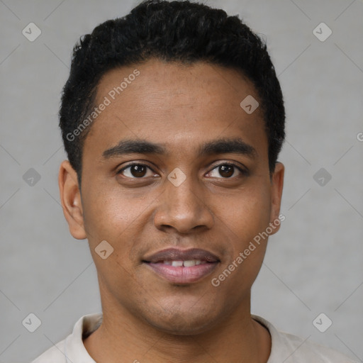 Joyful black young-adult male with short  black hair and brown eyes