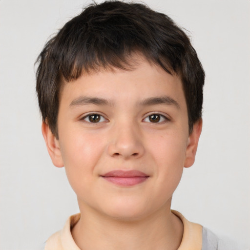 Joyful white child male with short  brown hair and brown eyes