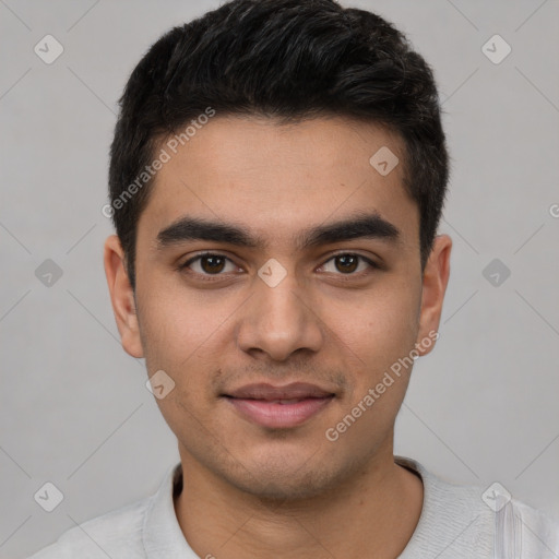 Joyful white young-adult male with short  black hair and brown eyes