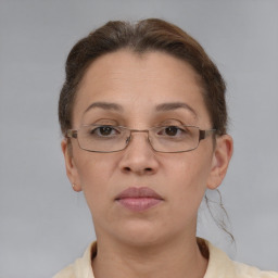 Neutral white adult female with short  brown hair and brown eyes