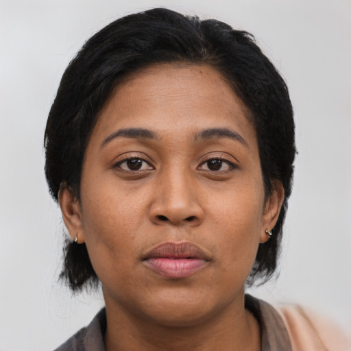 Neutral latino young-adult female with medium  black hair and brown eyes