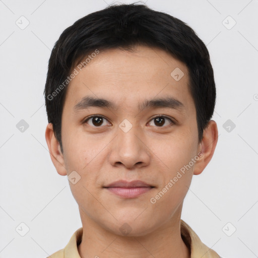 Joyful white young-adult male with short  black hair and brown eyes