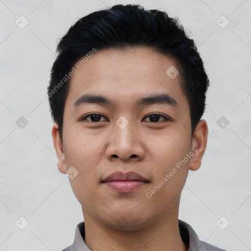 Joyful asian young-adult male with short  black hair and brown eyes