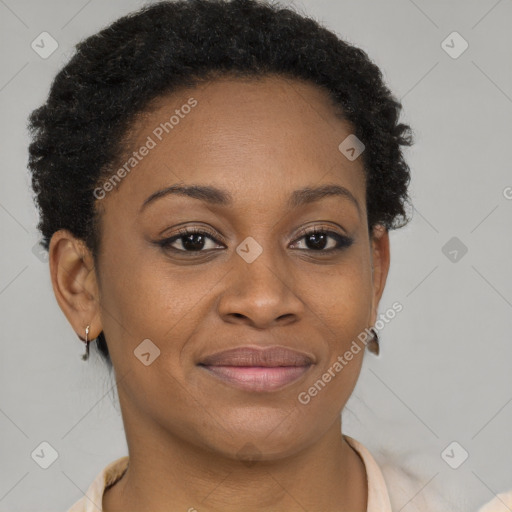 Joyful black adult female with short  brown hair and brown eyes