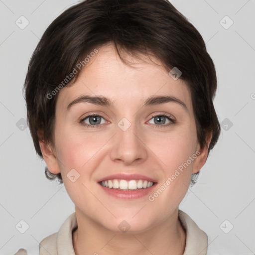 Joyful white young-adult female with short  brown hair and grey eyes