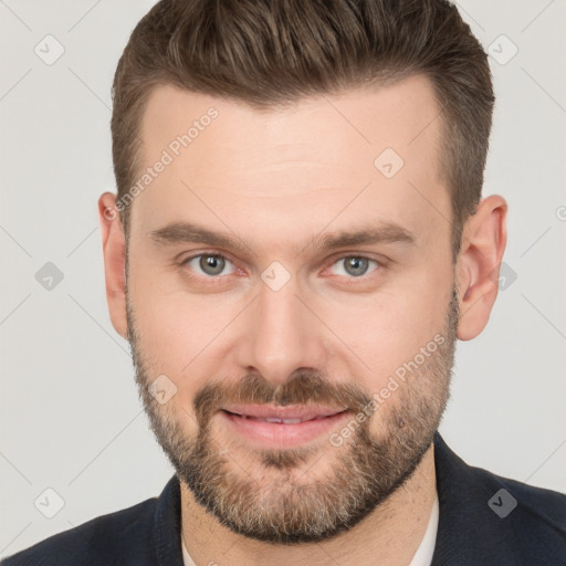 Joyful white adult male with short  brown hair and brown eyes