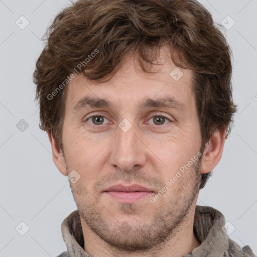 Joyful white adult male with short  brown hair and grey eyes