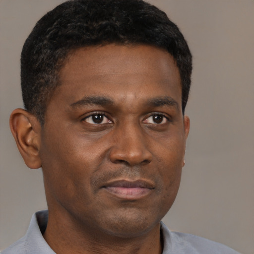 Neutral black young-adult male with short  brown hair and brown eyes