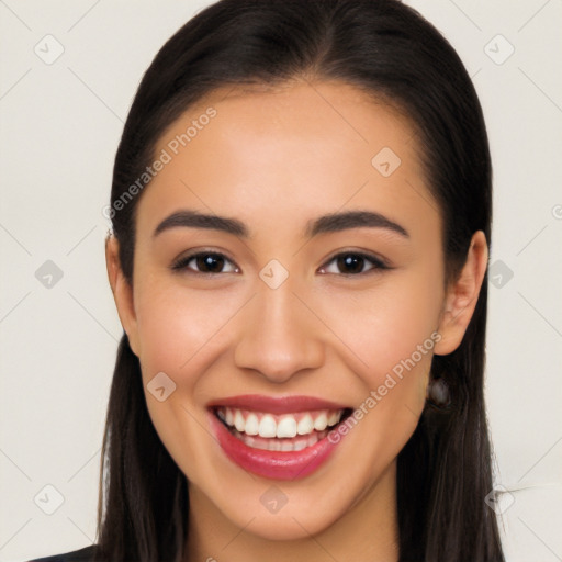 Joyful latino young-adult female with long  brown hair and brown eyes