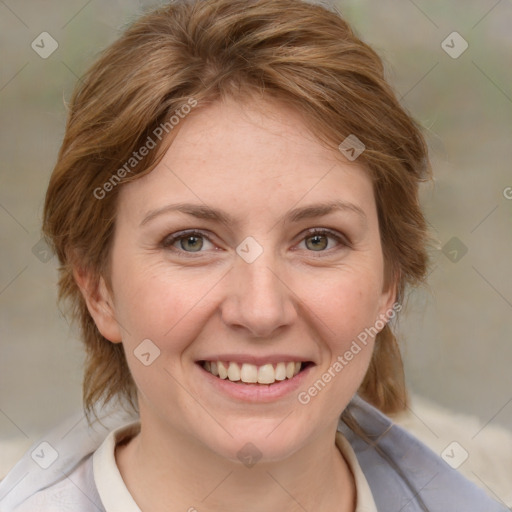 Joyful white adult female with medium  brown hair and blue eyes