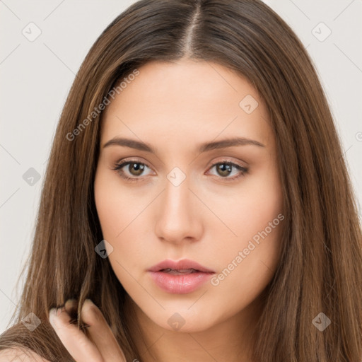 Neutral white young-adult female with long  brown hair and brown eyes