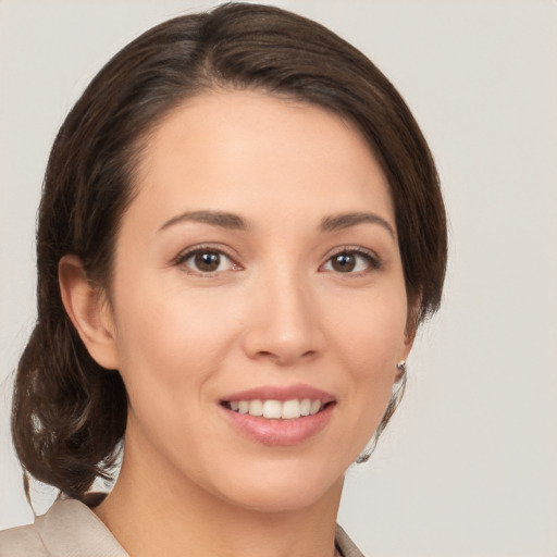 Joyful white young-adult female with medium  brown hair and brown eyes