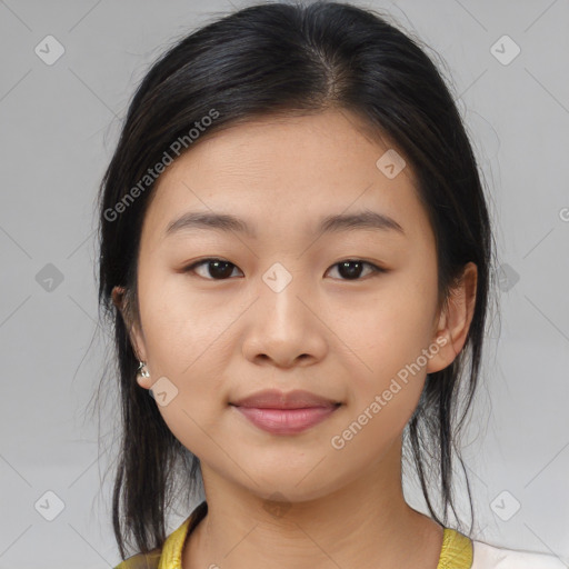 Joyful asian young-adult female with medium  brown hair and brown eyes