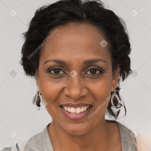 Joyful black adult female with short  brown hair and brown eyes