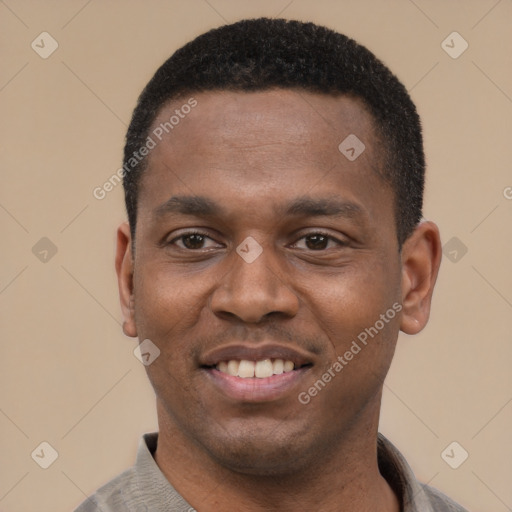 Joyful black young-adult male with short  black hair and brown eyes