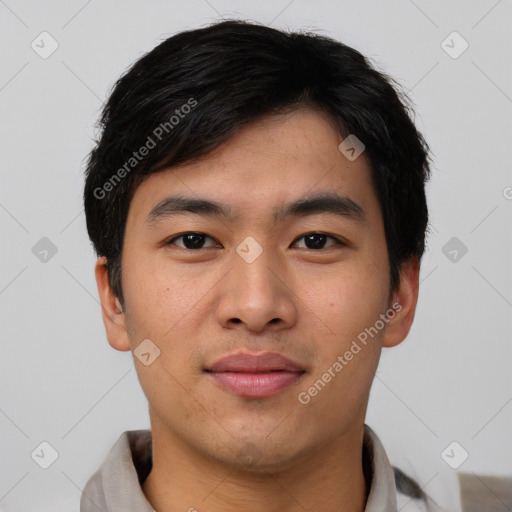 Joyful asian young-adult male with short  black hair and brown eyes