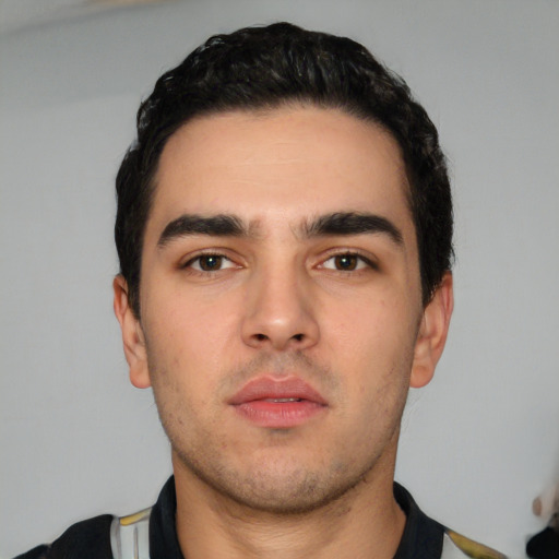 Neutral white young-adult male with short  black hair and brown eyes