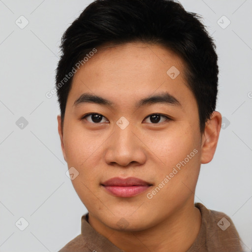 Joyful asian young-adult male with short  black hair and brown eyes