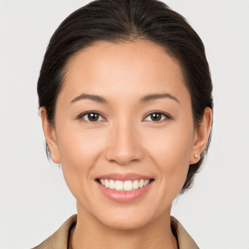 Joyful white young-adult female with medium  brown hair and brown eyes