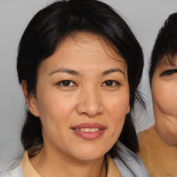 Joyful white adult female with medium  brown hair and brown eyes