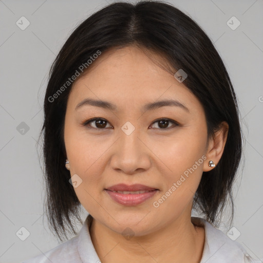 Joyful asian young-adult female with medium  brown hair and brown eyes