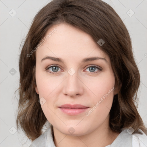 Joyful white young-adult female with medium  brown hair and green eyes