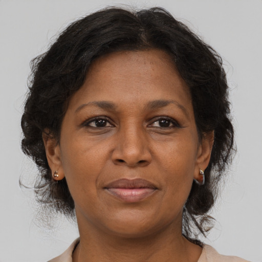 Joyful asian adult female with medium  brown hair and brown eyes