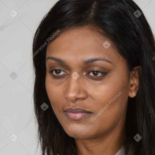 Joyful latino young-adult female with long  brown hair and brown eyes