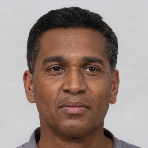 Neutral latino adult male with short  black hair and brown eyes