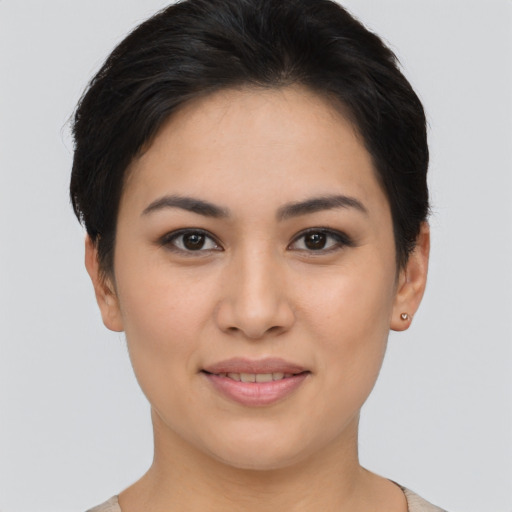 Joyful asian young-adult female with short  brown hair and brown eyes
