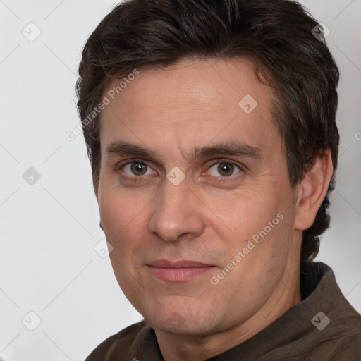 Joyful white adult male with short  brown hair and brown eyes