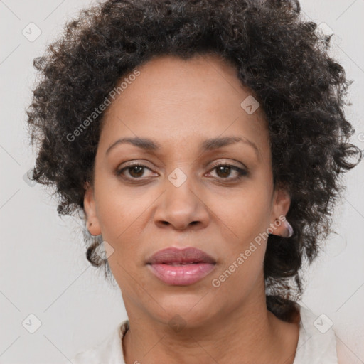 Joyful black adult female with short  brown hair and brown eyes