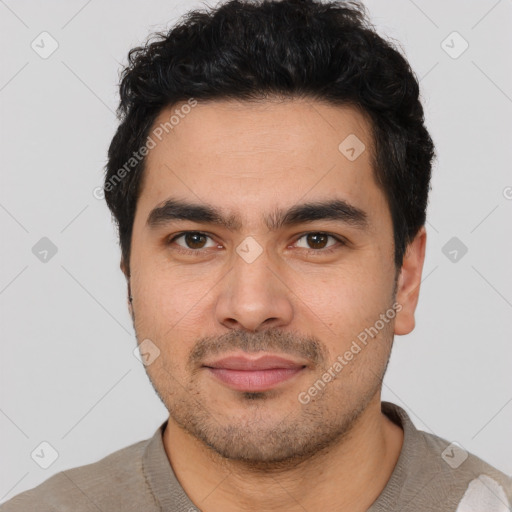 Joyful latino young-adult male with short  black hair and brown eyes