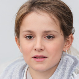 Joyful white child female with medium  brown hair and blue eyes