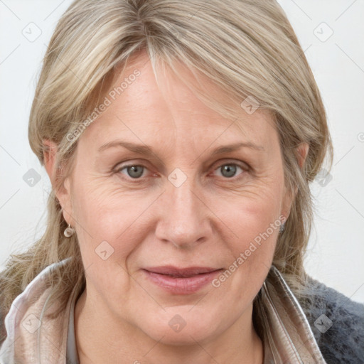 Joyful white adult female with medium  brown hair and grey eyes