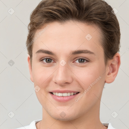 Joyful white young-adult female with short  brown hair and grey eyes