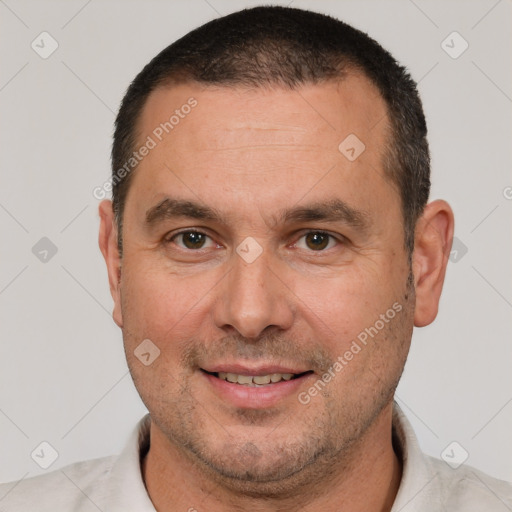 Joyful white adult male with short  brown hair and brown eyes