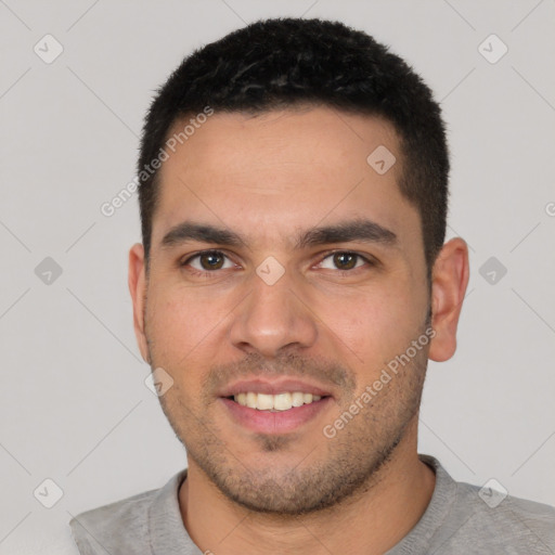 Joyful white young-adult male with short  black hair and brown eyes
